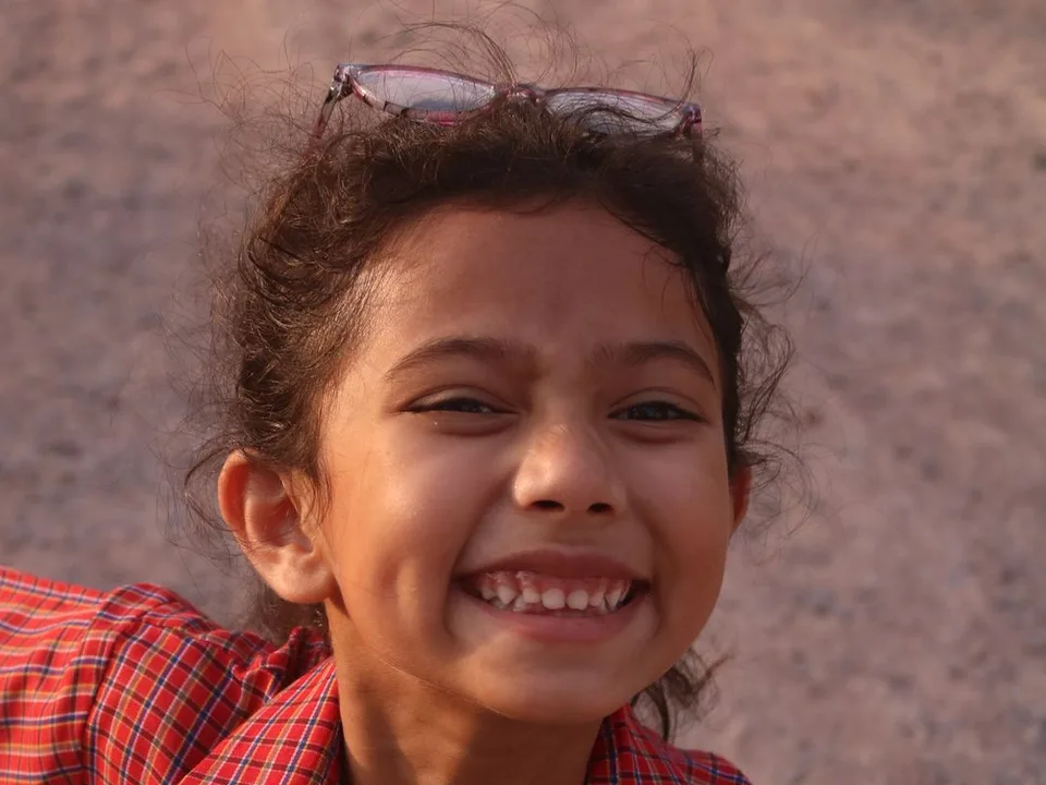 Happy Indian child laughing – early teeth alignment check for children in Dombivli